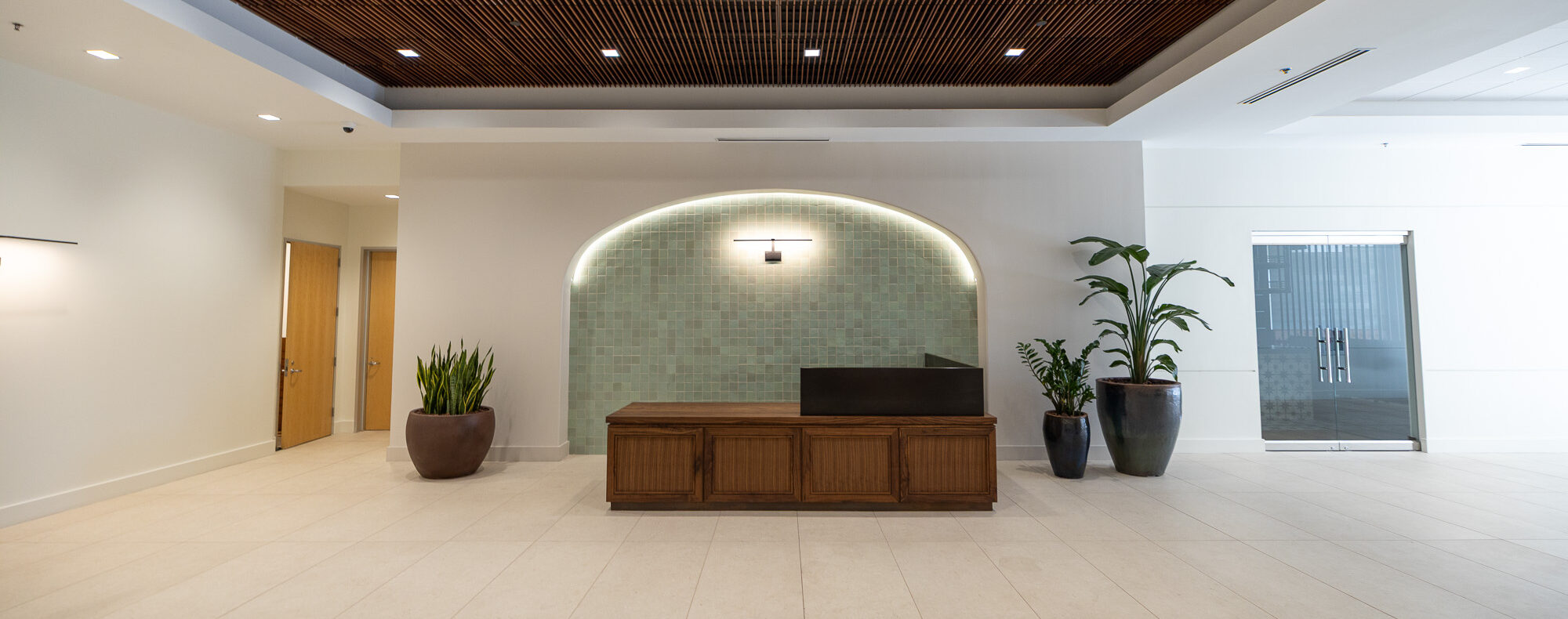 Travis Millwork completed this L-shaped reception desk for Metropolitan Construction.