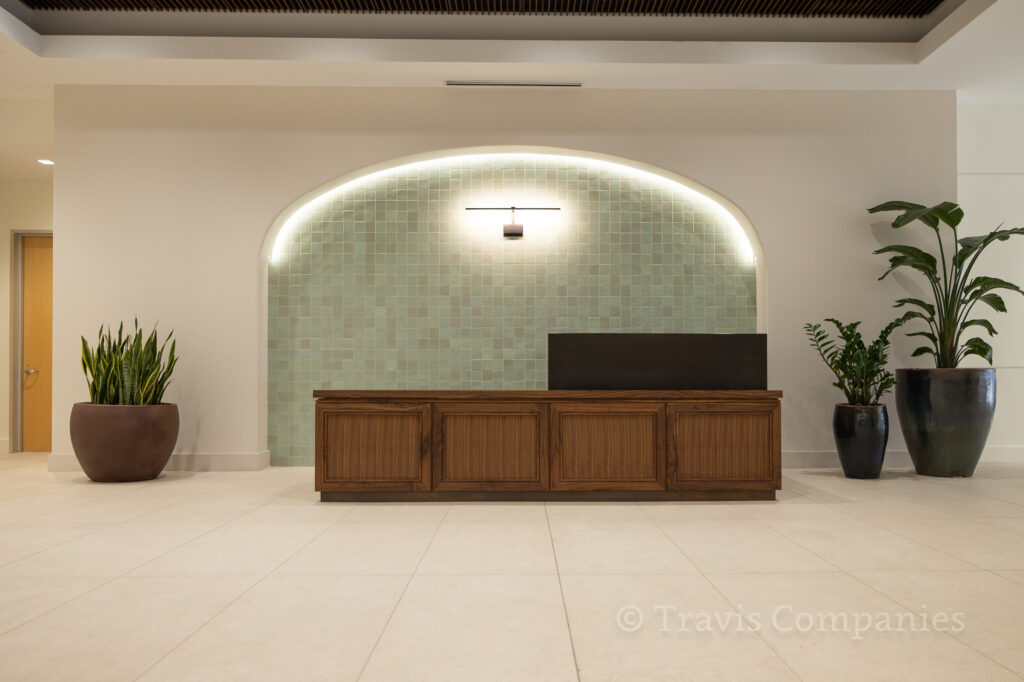 Travis Millwork completed this L-shaped reception desk for Metropolitan Construction.