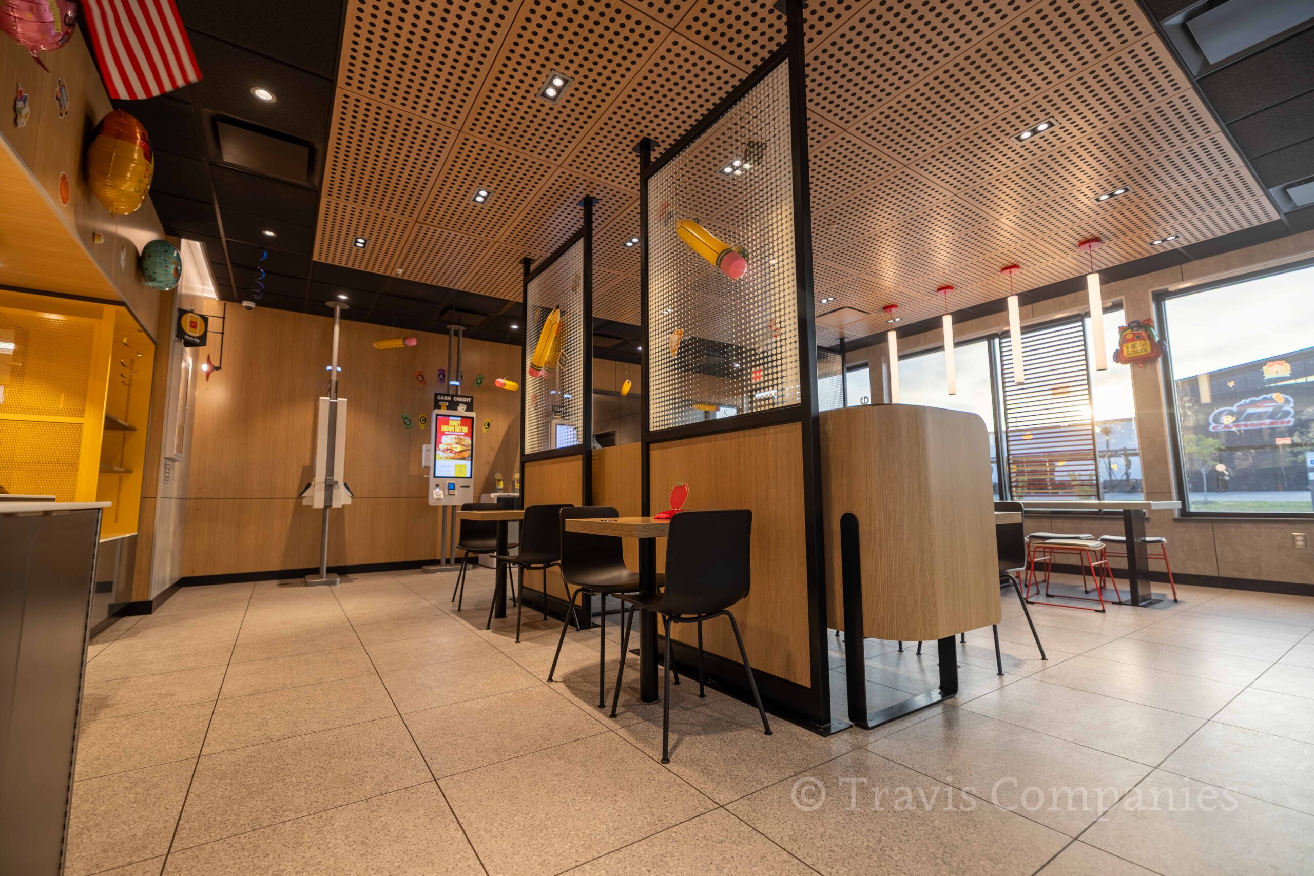 McDonald's painting contractor McDonald's dining room with vinyl wall coverings and painted ceiling, Texas and divider.