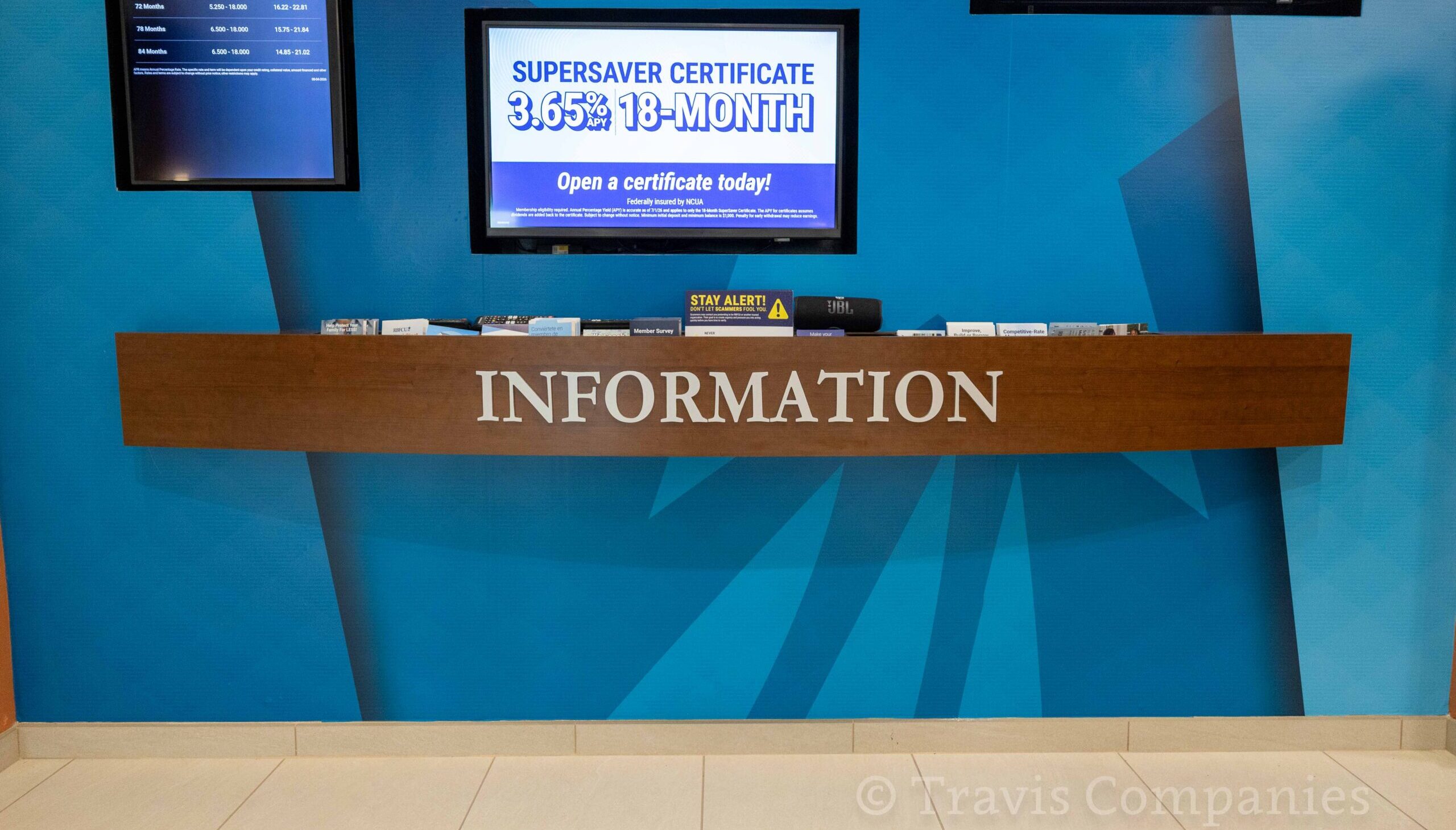 Curved brochure display with plexiglass at RBFCU by Travis Millwork